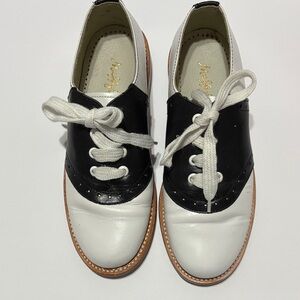 Muffy Black and White Lace-Up Oxfords.